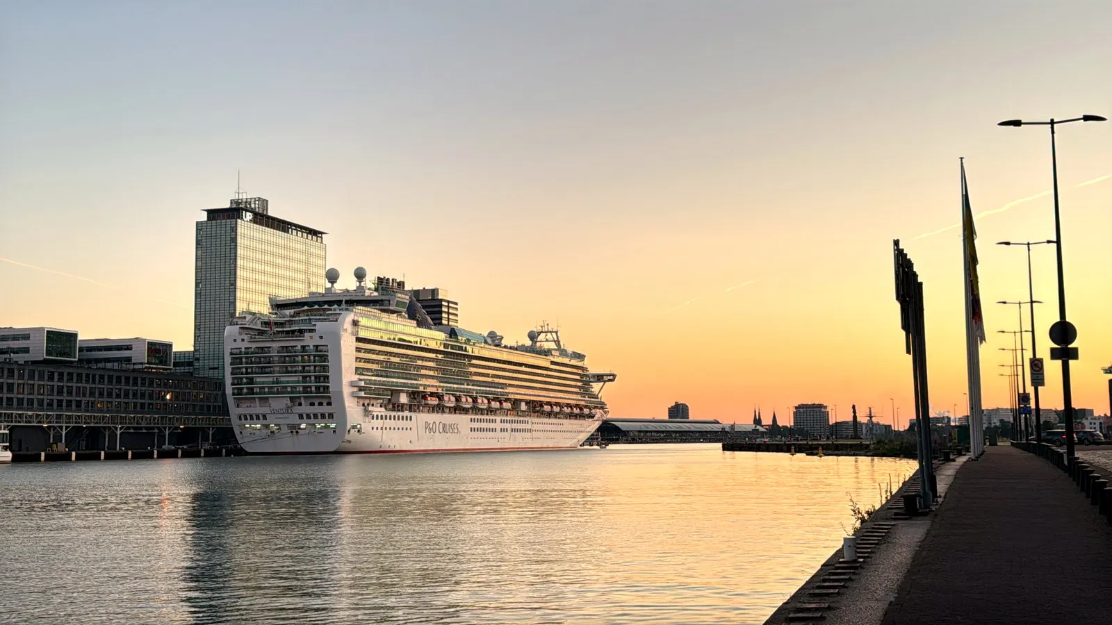 Cruise ship docked at Passenger Terminal Amsterdam at sunrise