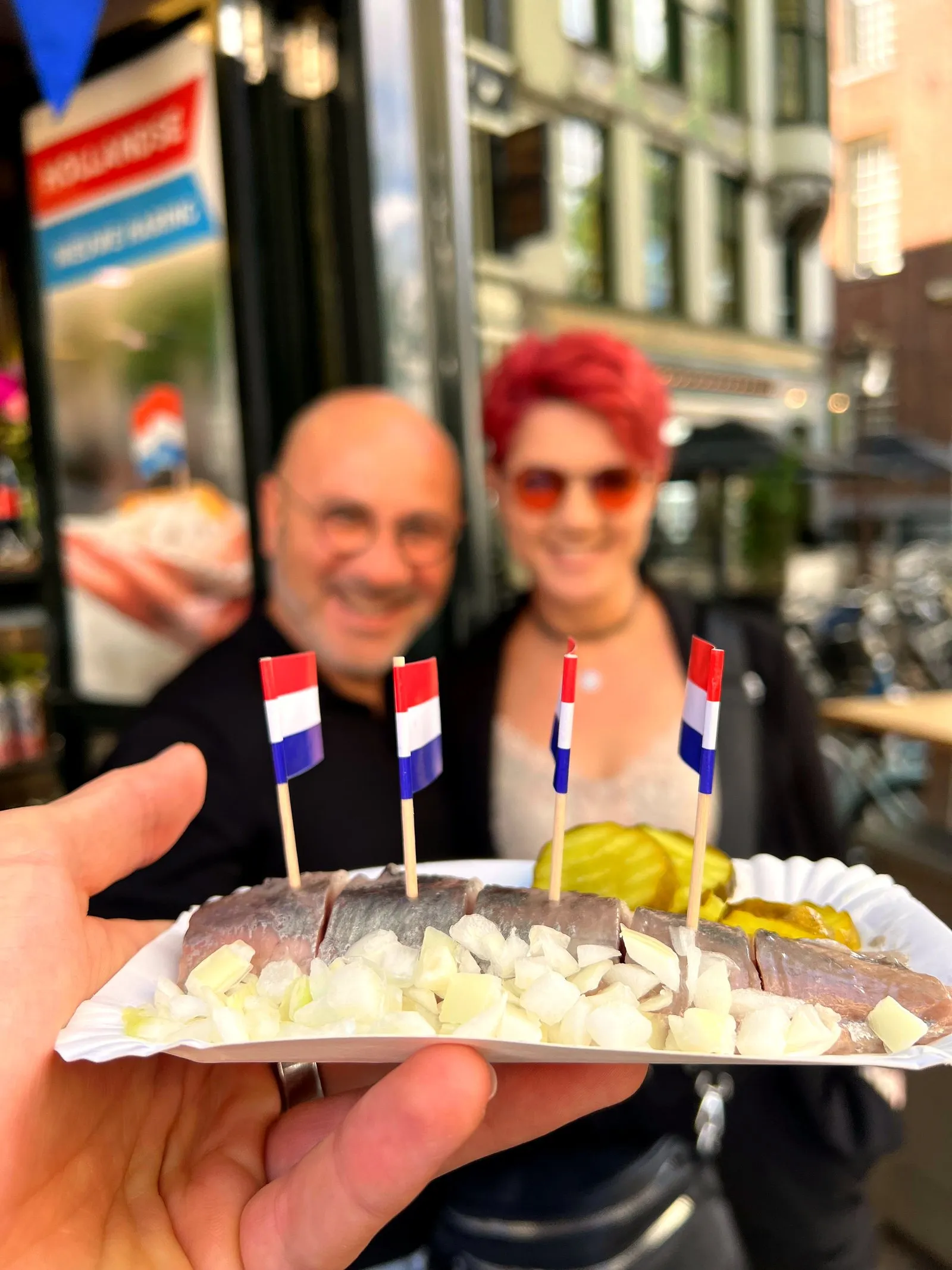 Close-up of a herring tray with chopped onion and Dutch flag picks