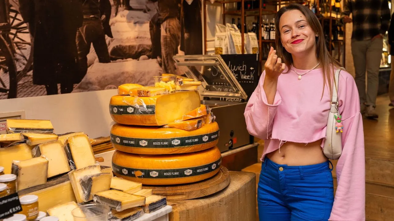 Guest sampling artisanal cheese on a guided Wine & Cheese Tour in Amsterdam.