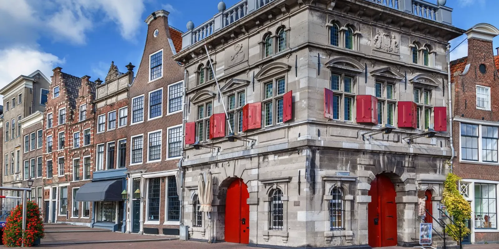 Haarlem's historic Vleeshal with red shutters on the Grote Markt